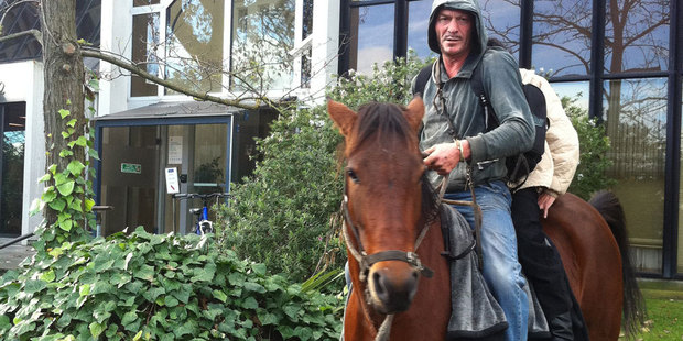 Richard James Hayden, accused of being the owner of a horse that escaped and caused an accident on a Christchurch motorway, arrives at court on his horse Beauti-foal. Photo / Kurt Bayer