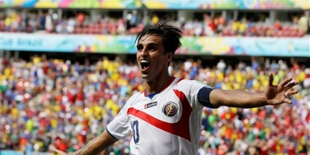 Costa Rica's Bryan Ruiz celebrates after scoring his side's first goal over Italy's goalkeeper Gianluigi Buffon during the group D World Cup soccer match between Italy and Costa Rica. Photo / AP