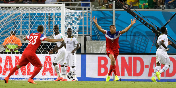 United States' John Brooks, second right, celebrates after scoring his side's second goal against Ghana. Photo / AP