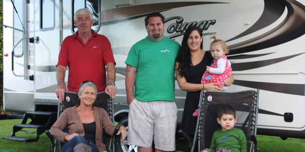 Standing are John Blair, Nick Blair and Nick's fiancee Faith Adams, holding their daughter Aliya Blair; Seated are Joan Blair and Lochlan Blair.