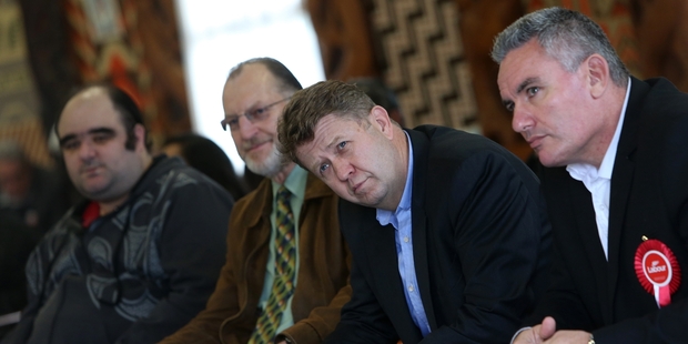 Labour leader David Cunliffe, second from right, and Labour's Te Tai Tokerau election candidate, Kelvin Davis (right) listen intently to speeches made as they were welcomed to Te Renga Paraoa Marae in Whangarei. Photo / Michael Cunningham