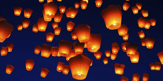 Sky lanterns float above the crowds. Photo / Thinkstock