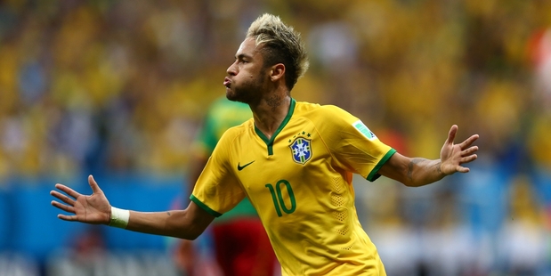 Neymar notched two first-half goals to start Brazil on the road to a comfortable victory over Cameroon.
