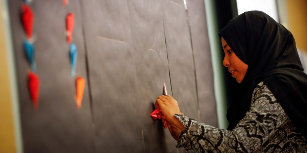 Relatives of missing MH370 passengers are still hoping and praying the plane will be found. Photo / AP