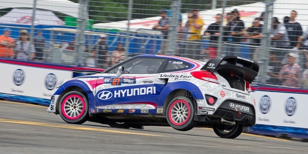 Emma Gilmour drives her Hyundai Veloster Global Rallycross Championship car onto three wheels at the Washington DC round. Photo / Supplied
