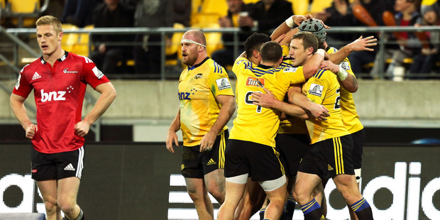 Hurricanes players celebrate the try of Blade Thomson during the round 17 Super Rugby match between the Hurricanes and the Crusaders. Photo / Getty.