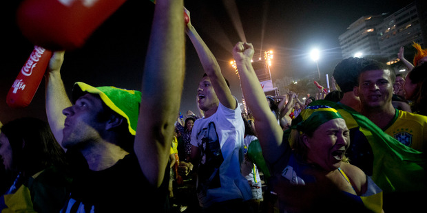 Soccer fans celebrate Brazil's second goal in the World Cup opener against Croatia. Photo / AP