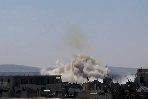 File photo of smoke rising from a building after Syrian military airstrikes. Photo / AP