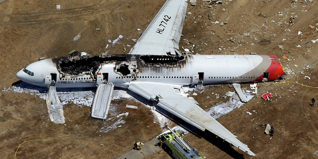 The wreckage of Asiana Flight 214 lies on the ground after it crashed at the San Francisco International Airport in July 2013. Photo / AP