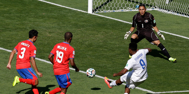 England's Daniel Sturridge kicks the ball next to Costa Rica's Roy Miller and Giancarlo Gonzalez during the group D World Cup soccer match between Costa Rica and England. Photo / AP