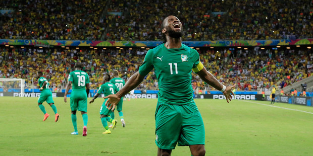 Ivory Coast's Didier Drogba (11) celebrates after Wilfried Bony scored his side's first goal against Greece's goalkeeper Panagiotis Glykos. Photo / AP