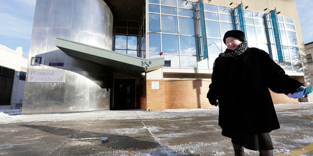 2013 file photo shows anti-abortion protester Eleanor McCullen, of Boston, standing at the painted edge of a buffer zone outside a Planned Parenthood location in Boston. Photo / AP