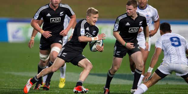 Damian McKenzie (centre) in action against Samoa, during the Pool C rugby match between New Zealand and Samoa at the IRB Junior World Championship. Photo / Dean Purcell