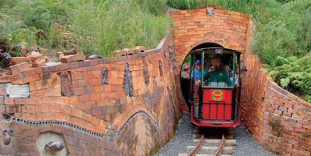 Passengers aboard Driving Creek Railway's Possum train emerge from a tunnel. Photo / Supplied