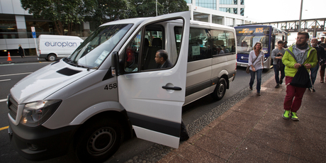 An AT worker boards a staff shuttle that runs between Auckland City and Henderson. Photo / Greg Bowker