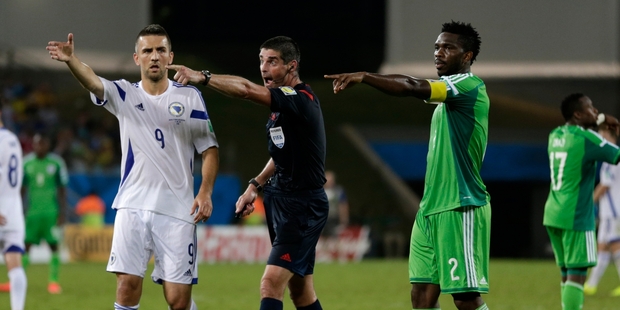 Kiwi ref Peter O'Leary , centre, and his assistants made a controversial call. Photo / AP