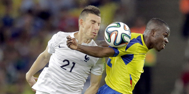 France's Laurent Koscielny goes up against Ecuador's Enner Valencia. Photo / AP