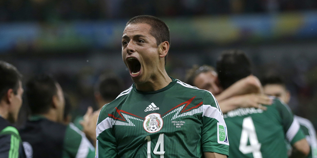 Mexico's Javier Hernandez celebrates after his team scored its first goal against Croatia. Photo / AP