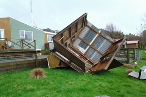 A shed was slammed into a fence on the property during the brief tornado.