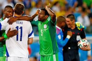 New Zealand referee Peter O'Leary talks to Nigerian goalkeeper Vincent Enyeama, background right, following Nigeria's 1-0 win over Bosnia-Herzegovina. Photo / Getty Images