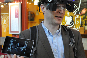 The smart glasses provide simple images of nearby people and objects to help those who are registered blind get around. Photo / Oxford University