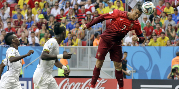 Cristiano Ronaldo goes close with a header during the group G World Cup soccer match between Portugal and Ghana. Photo / AP