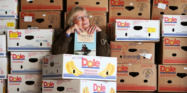 Bev Cowley, Zonta Book Sale Co-Ordinator for Zonta Hatea, stands amongst 200 banana boxes yet to be filled while another 800 boxes are already full. Photo / Michael Cunningham