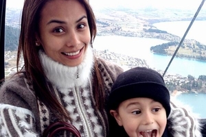 Mona Dotcom and one of her children take a break in Queenstown.