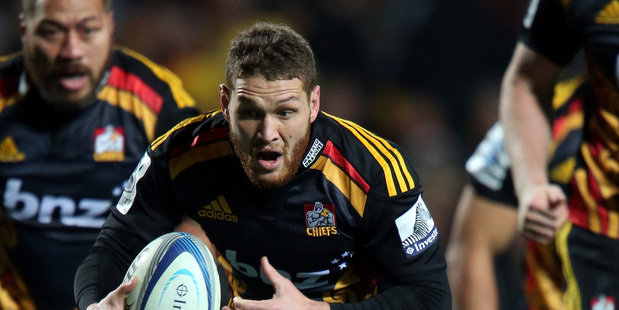 Tawera Kerr-Barlow of the Chiefs scampers from the base of a ruck. Photo / Getty Images