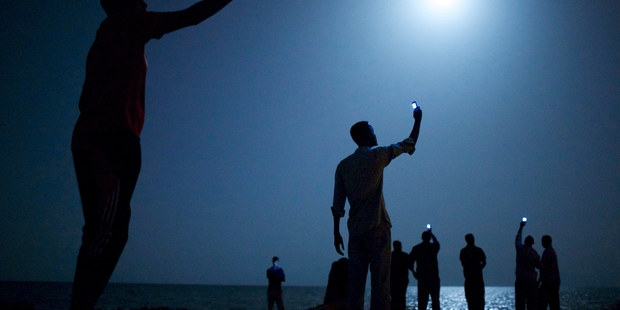 John Stanmeyer likes to get lost in the process of finding the narrative; the proof is in his winning photo of African migrants trying to get a cellphone signal.