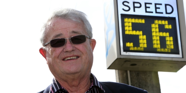 Bill Rossiter, long-time Whangarei road-safety campaigner, wants more of the speed warning signs that he's pictured with to be used on the district's roads to reduce speed.Photo/John Stone