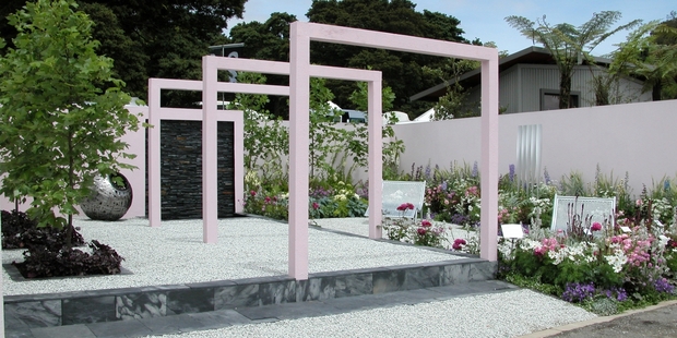 These pink arches give the garden rhythm.