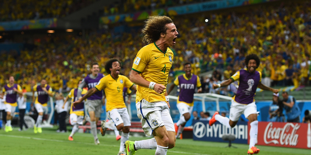 Brazil's David Luiz celebrates after scoring his team's second goal in Brazil's 2-1 win over Colombia. Photo / Getty Images
