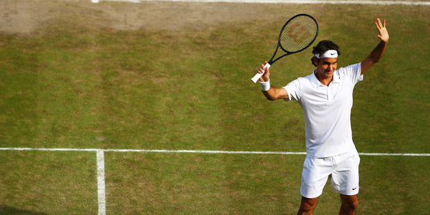 Roger Federer celebrates after winning his Wimbledon semi-final against Milos Ranoic. Photo / Getty Images