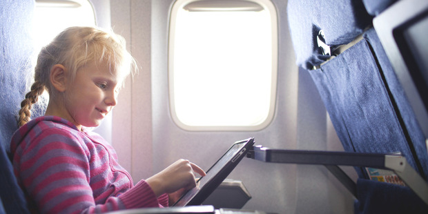Air NZ says its customers can now use electronic devices - such as tablets and smartphones - for the duration of their journey. They must be in non-transmitting (flight) mode. Photo / Thinkstock
