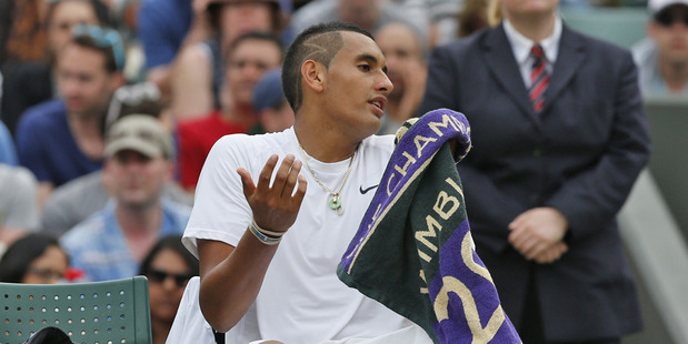 Nick Kyrgios of Australia talks with the umpire during the men's singles quarter-final match against Milos Raonic. Photo / AP