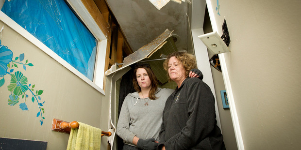 Carletta Bongard (R) and daughter, Alesha Rodgers, in their bathroom after a lightning strike hit the Papakura house last night. Photo / Sarah Ivey