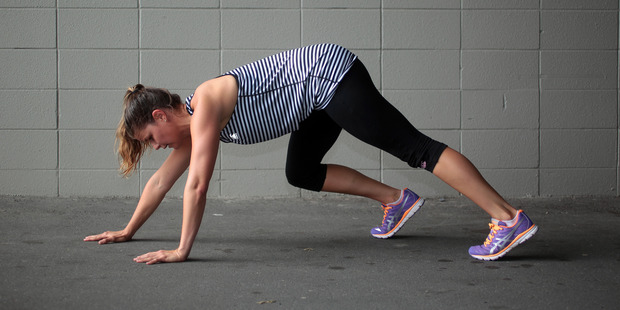 Kelly Friend demonstrates the bear crawl. Photo / Doug Sherring