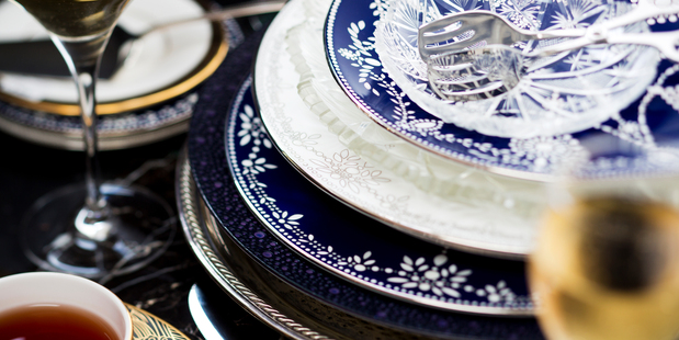 Plates, tea cup, cake knife and cake trowel, pastry pliers and wine glasses from The Studio of Tableware. Silver serving tray from Romantique. Photo / Babiche Martens.