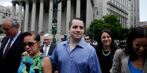 GIlberto Valle, centre, leaves Manhattan federal court in New York on Tuesday, July 1, 2014. His convictions were overturned by a judge. Photo / AP