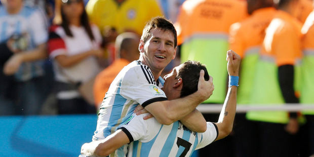 Argentina's Angel di Maria, right, and Lionel Messi celebrate after di Maria scored during the World Cup round of 16 soccer match between Argentina and Switzerland. Photo / AP
