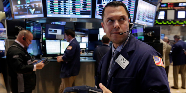 Trader Michael Zicchinolfi works on the floor of the New York Stock Exchange. File photo / AP