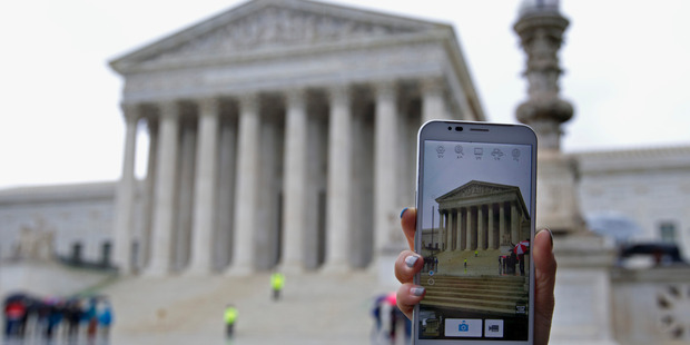 The United States Supreme Court delivered a victory for personal privacy rights last week and ruled the warrantless search of mobile phones unconstitutional. Photo / AP