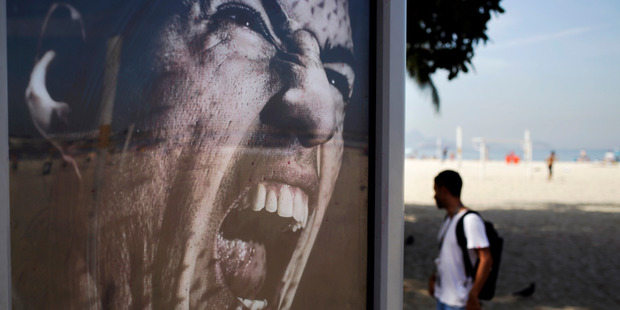 Adidas advertising featuring Uruguay's soccer striker Luis Suarez in Rio de Janeiro. Adidas has stopped using Suarez for World Cup marketing following his ban for biting an opponent. Photo / AP