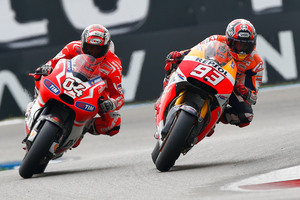 Marc Marquez on his Honda, right, overtakes Andrea Dovizioso of Italy riding his Ducati during the MotoGP Race of the Dutch Grand Prix, in Assen, northern Netherlands. Photo / AP