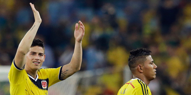 Colombia's James Rodriguez, left, waves to supporters following Colombia's 2-0 victory over Uruguay. Photo / AP