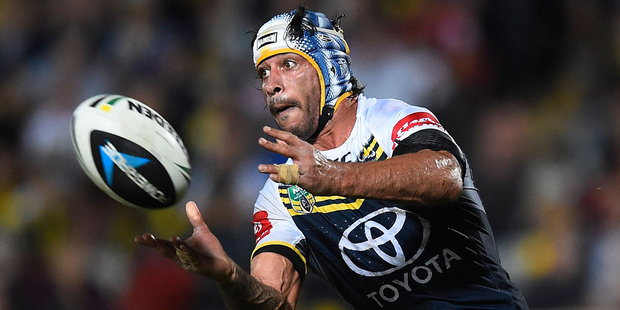 North Queensland's Johnathan Thurston passes the ball during the match between the North Queensland Cowboys and the South Sydney Rabbitohs in Townsville on Saturday night. Photo / Getty Images