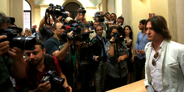 Raffaele Sollecito leaves after attending a press conference in Rome yesterday. Photo / AP