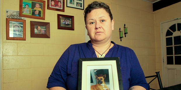 Hayley Anderton with a photo of her impounded dog Dougie. Photo/Warren Buckland