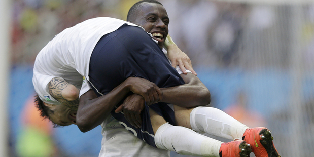 France's Blaise Matuidi carries his teammate Mathieu Valbuena as they celebrate their side's World Cup win over Nigeria. Photo / AP